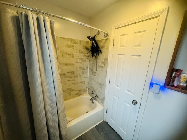 bathroom featuring wood-type flooring and shower / bath combination with curtain