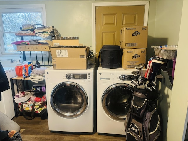 laundry room with separate washer and dryer and wood-type flooring