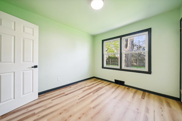 empty room with light wood-type flooring