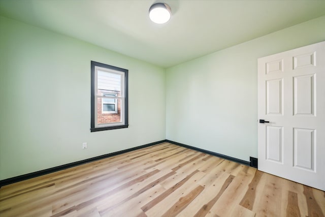 empty room with light wood-type flooring