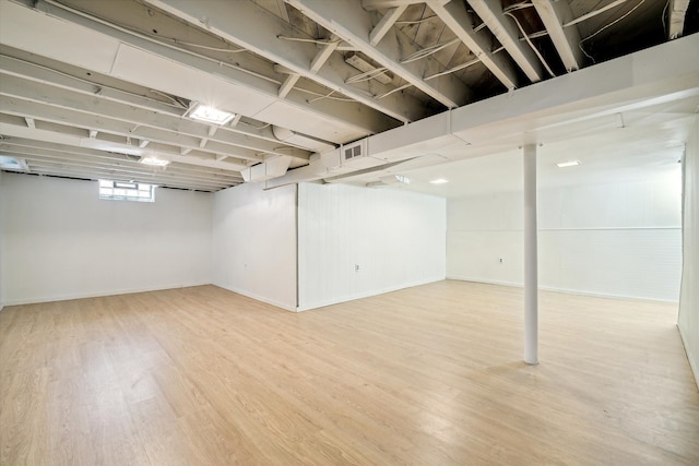 basement featuring hardwood / wood-style flooring