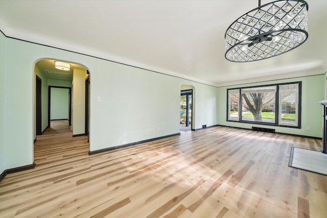 unfurnished living room featuring light hardwood / wood-style floors