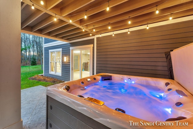 view of patio / terrace with a hot tub