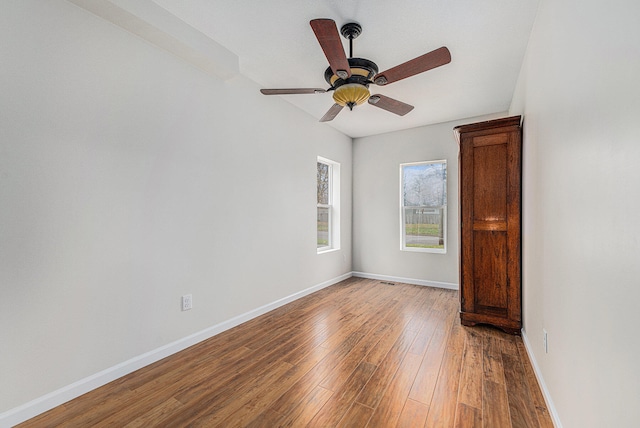 unfurnished room featuring hardwood / wood-style flooring and ceiling fan