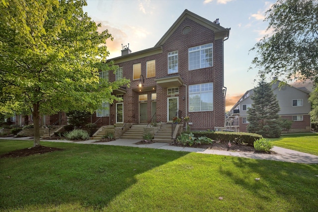 view of front of house with a yard