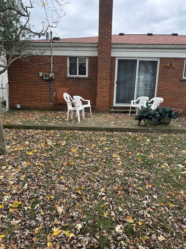 rear view of property featuring a patio area