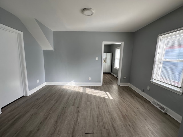 unfurnished room featuring dark hardwood / wood-style floors