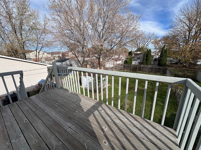 wooden terrace with a lawn