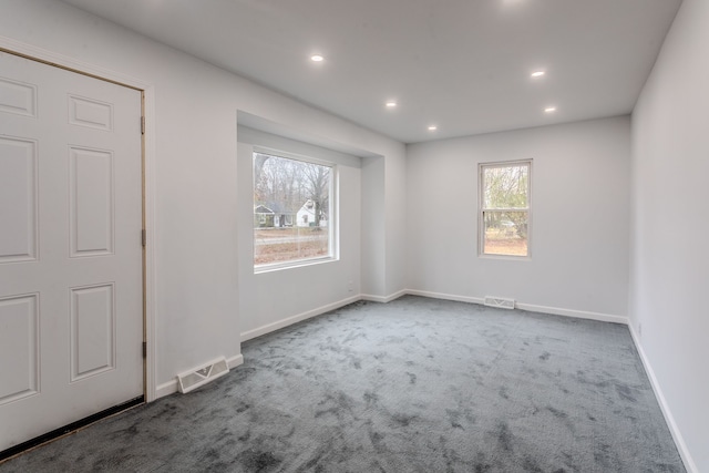 unfurnished room with carpet floors