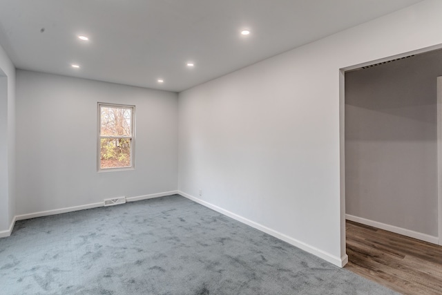 unfurnished room featuring dark hardwood / wood-style flooring