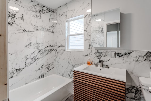 bathroom with vanity, a bath, tile walls, and toilet