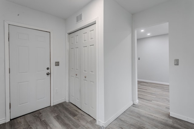 foyer with light wood-type flooring