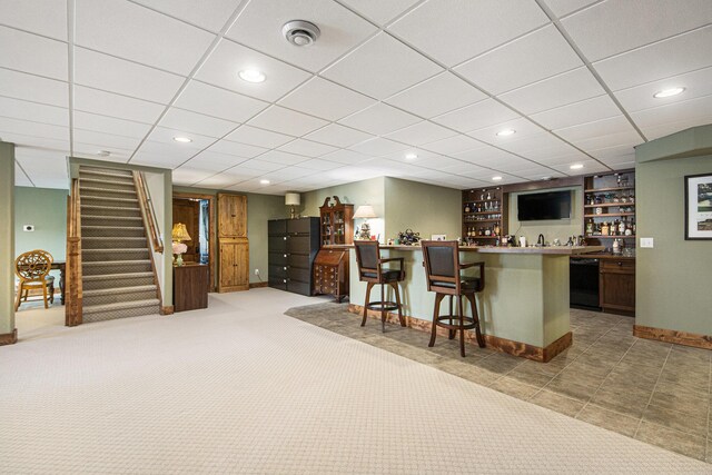 11325 Killarney Dr, Stanwood, MI 49346 - indoor wet bar with black dishwasher, baseboards, stairs, and recessed lighting
