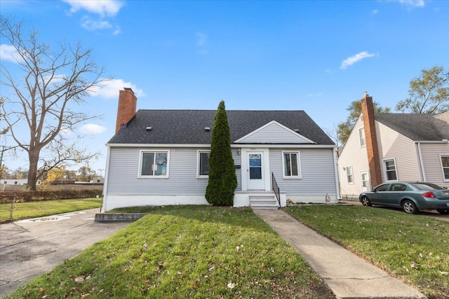 bungalow-style home featuring a front yard