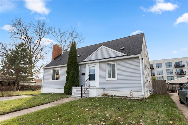 bungalow-style house with a front lawn