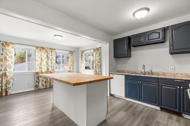 kitchen with sink, dark wood-type flooring, wooden counters, white dishwasher, and a kitchen island