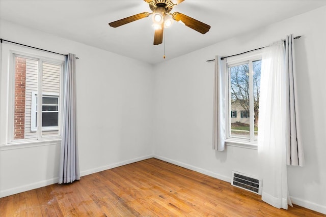 spare room with ceiling fan and light hardwood / wood-style floors