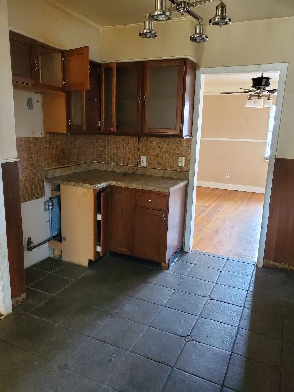 17366 Monica St, Detroit, MI 48221 - kitchen featuring backsplash and ceiling fan