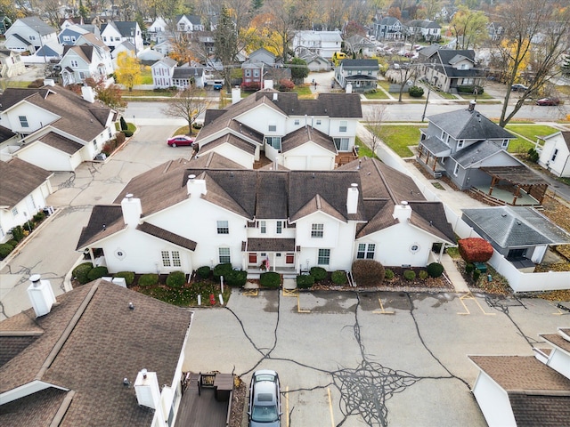 birds eye view of property with a residential view