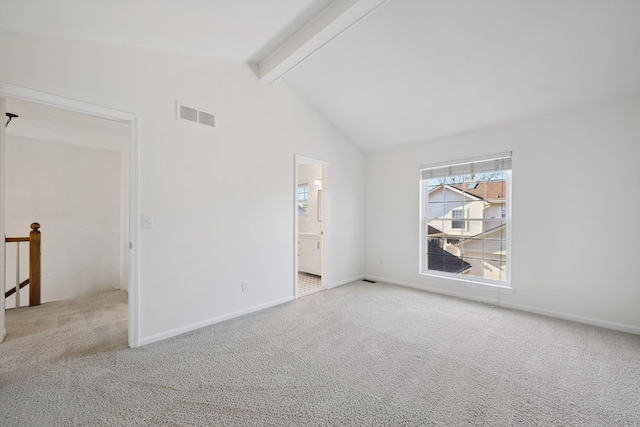spare room with visible vents, lofted ceiling with beams, baseboards, and carpet floors