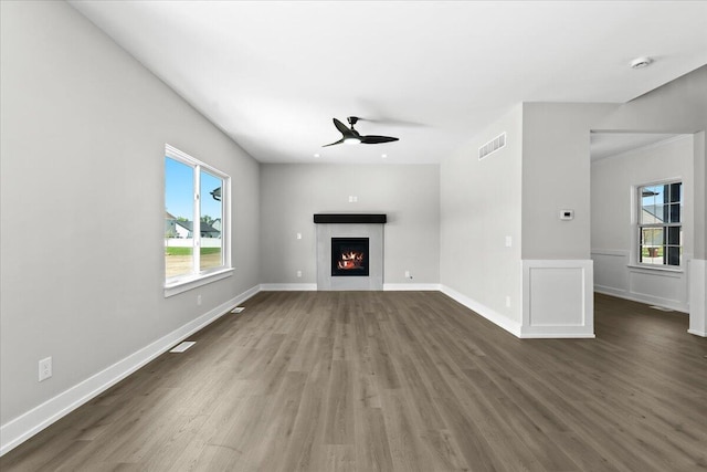 36135 Parkdale St Unit 5, Livonia, MI 48150 - unfurnished living room featuring a ceiling fan, dark wood finished floors, and plenty of natural light