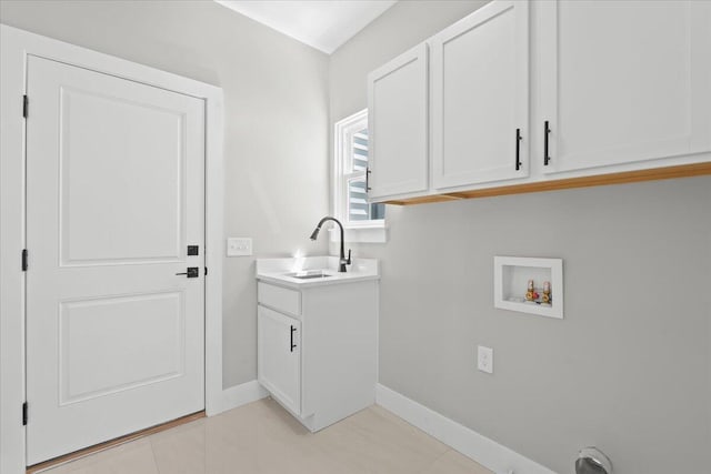 36135 Parkdale St Unit 5, Livonia, MI 48150 - laundry room featuring hookup for a washing machine, cabinet space, baseboards, and light tile patterned flooring
