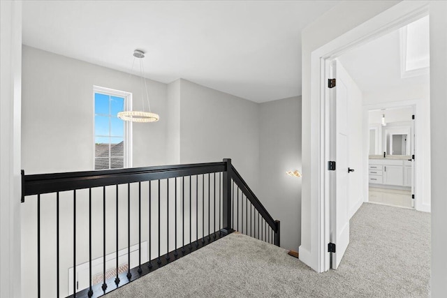 36135 Parkdale St Unit 5, Livonia, MI 48150 - hallway featuring an upstairs landing, carpet flooring, and baseboards