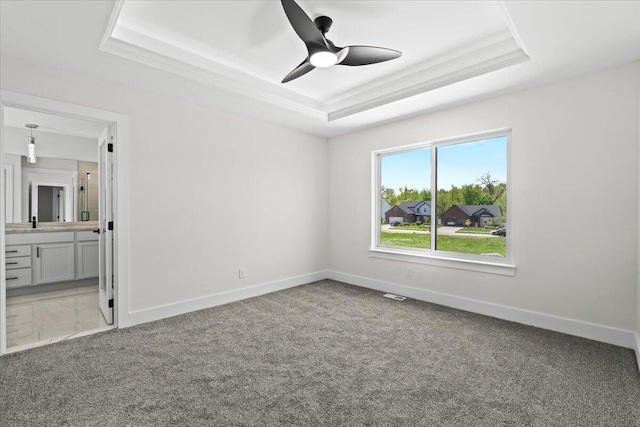 36135 Parkdale St Unit 5, Livonia, MI 48150 - unfurnished bedroom with a raised ceiling, carpet, baseboards, and ensuite bathroom