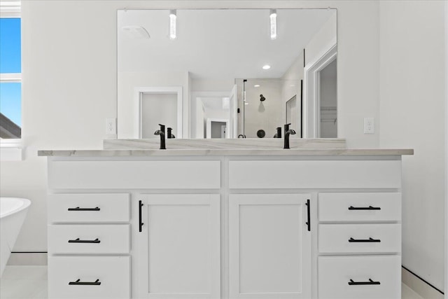 36135 Parkdale St Unit 5, Livonia, MI 48150 - bathroom with double vanity, a shower stall, and a soaking tub