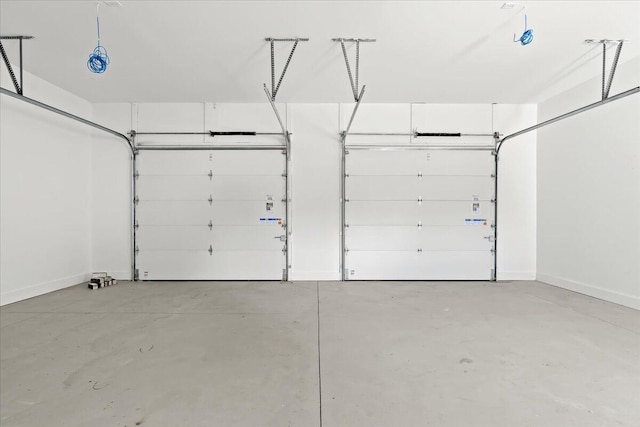 36135 Parkdale St Unit 5, Livonia, MI 48150 - garage featuring baseboards