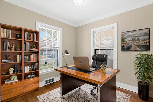 office space with dark hardwood / wood-style floors and crown molding