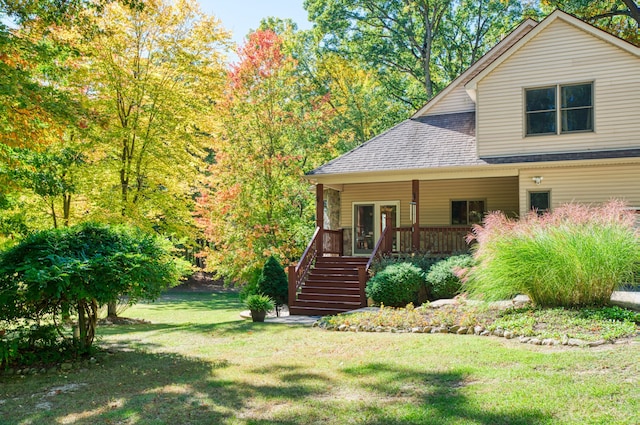 3592 Hillandale Dr, Howell, MI 48843 - view of front of property with stairs, a front yard, and roof with shingles