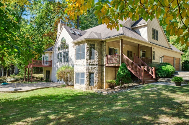 3592 Hillandale Dr, Howell, MI 48843 - view of front of property with stone siding, stairs, a front lawn, and a chimney