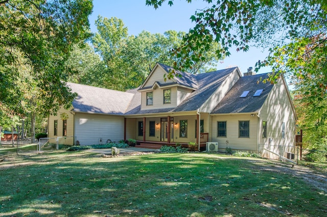 rear view of house with a lawn and ac unit