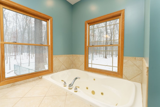 bathroom with tile patterned floors and tile walls