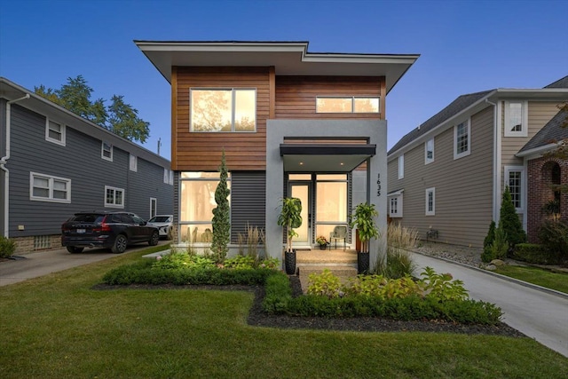 contemporary home with a front yard