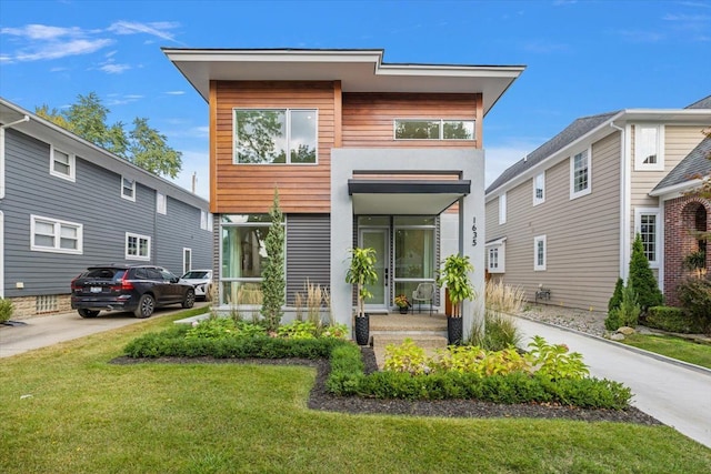 contemporary house with a front yard