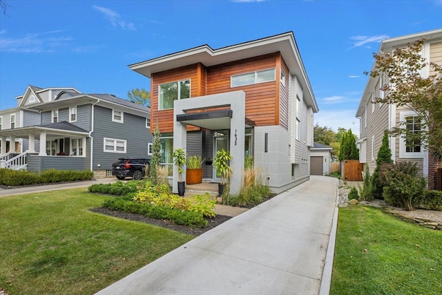 contemporary home featuring a front yard