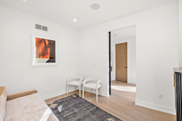 sitting room with light hardwood / wood-style floors