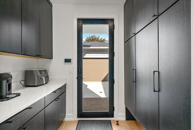 doorway to outside with light wood-type flooring