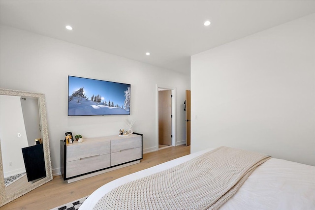 bedroom with light wood-type flooring