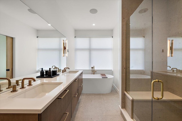 bathroom with vanity and separate shower and tub