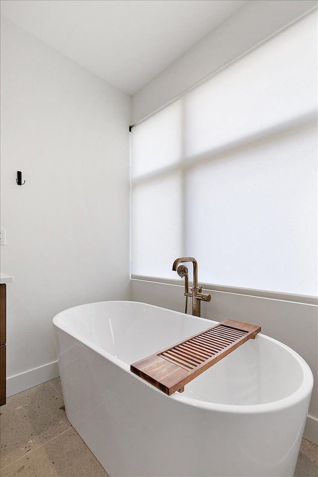 bathroom featuring a washtub