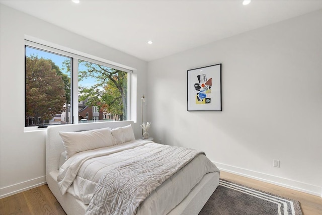 bedroom with wood-type flooring