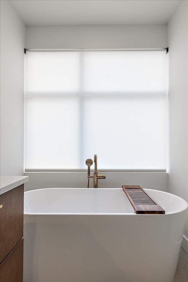 bathroom featuring vanity and a bathtub