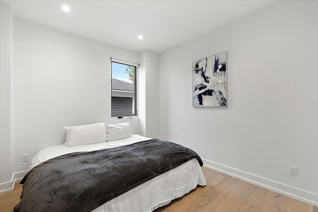 bedroom featuring hardwood / wood-style floors