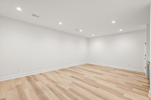 unfurnished room featuring light hardwood / wood-style floors