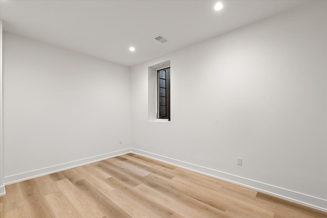 unfurnished room with light hardwood / wood-style flooring