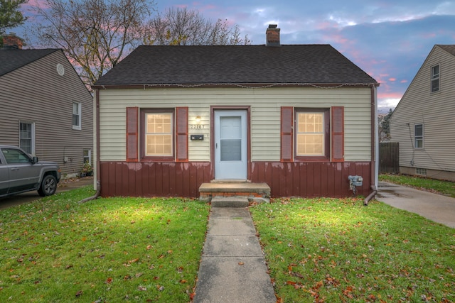 22167 Rausch Ave, Eastpointe, MI 48021 - view of front facade featuring a chimney and roof with shingles