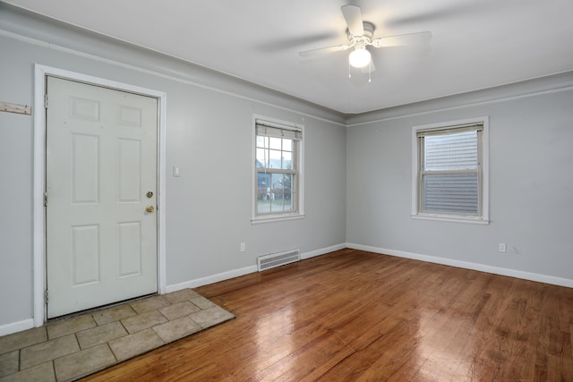 entrance foyer featuring ceiling fan and hardwood / wood-style flooring